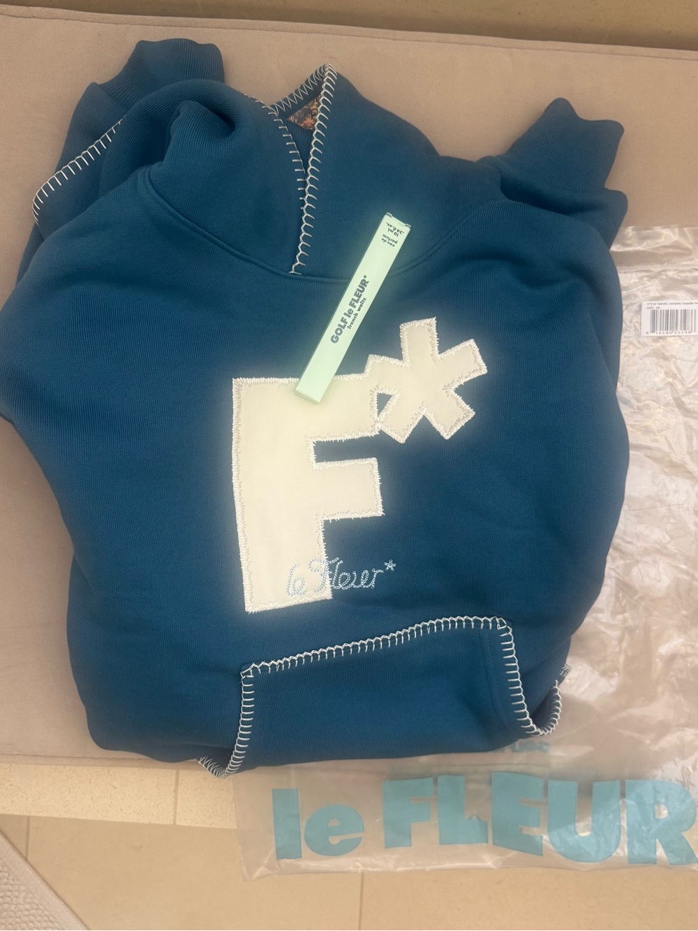 Golf Le Fleur Navy Hoodie and French Waltz travel cologne/perfume